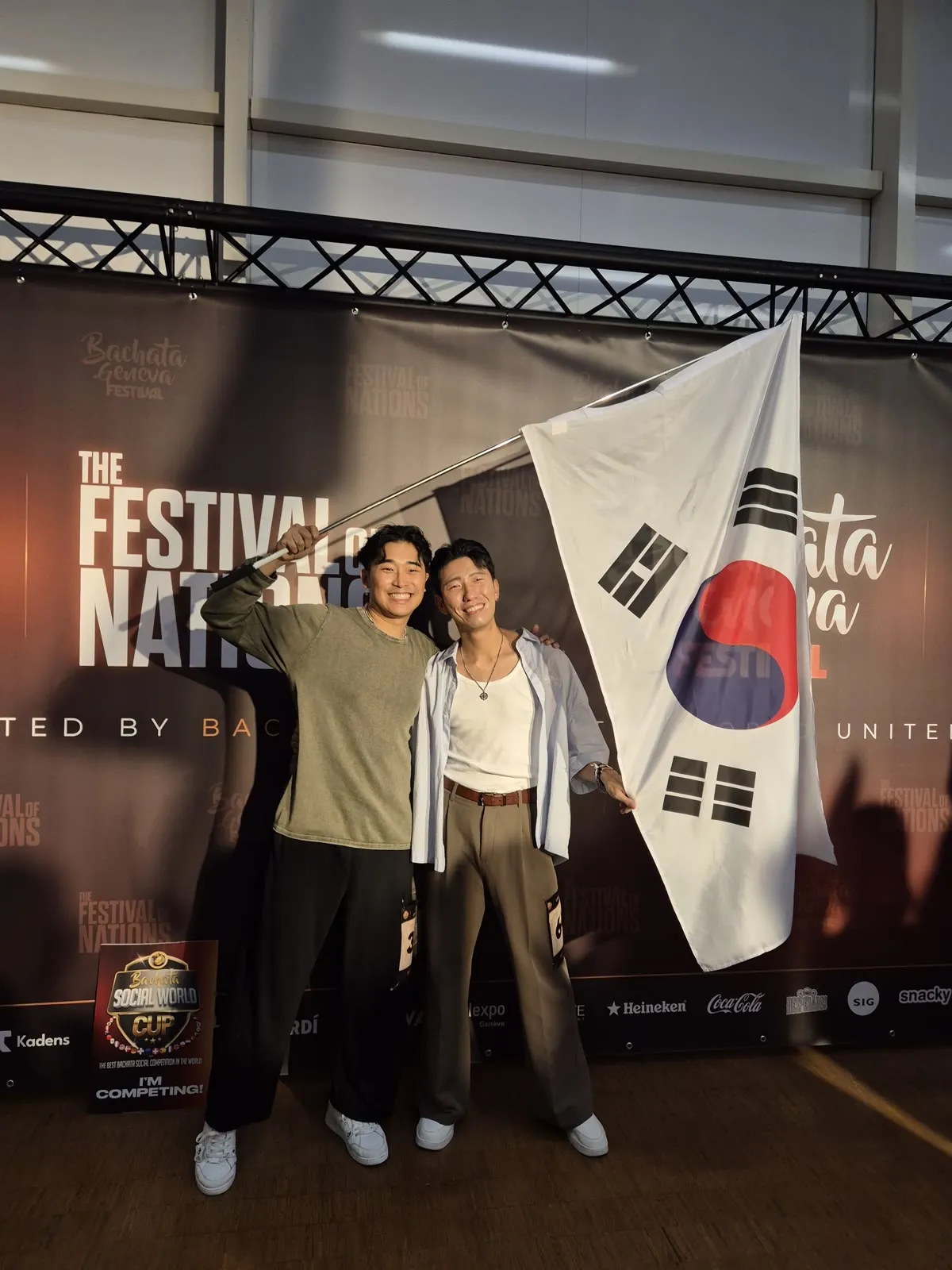 Daewoo and Waffle with the Korean flag at the Festival of Nations photo wall