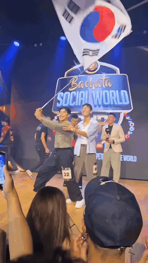 Daewoo and Waffle waving the Korean flag on the World Cup stage